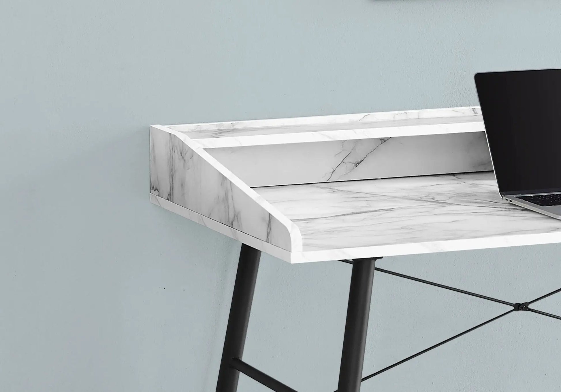 Marble-top computer desk with black angled legs and a laptop, contemporary home office desk on Tampa Home & Garden Store