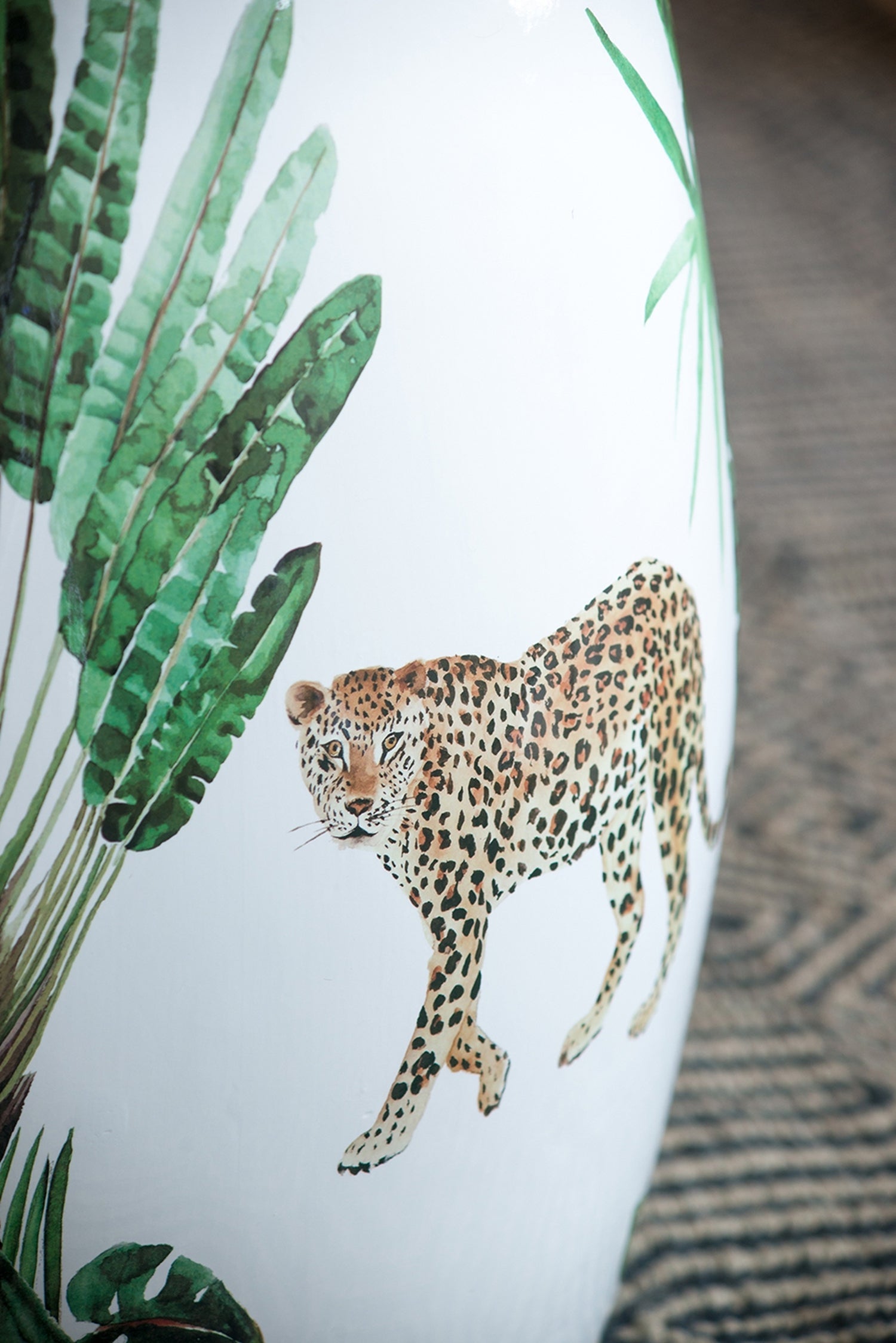 13x13x18 ceramic garden stool with leopard print and green palm leaves on white background on Tampa Home & Garden Store