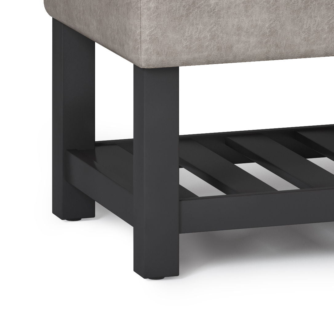 Cosmopolitan storage ottoman bench with open bottom, gray fabric upholstery and dark legs on Tampa Home & Garden Store