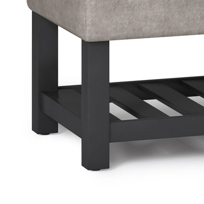 Cosmopolitan storage ottoman bench with open bottom, gray fabric upholstery and dark legs on Tampa Home & Garden Store