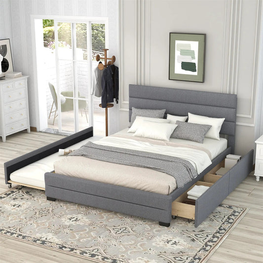 Queen-size gray upholstered platform bed with a twin trundle and two mattresses visible on Tampa Home & Garden Store