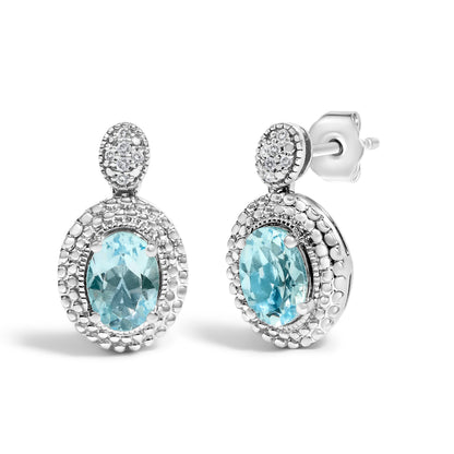 Pair of drop earrings in .925 sterling silver with oval blue topaz and diamond halo on Tampa Home & Garden Store