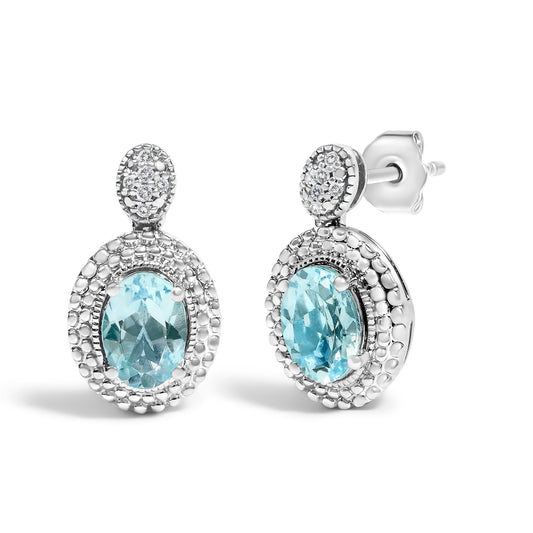 Pair of drop earrings in .925 sterling silver with oval blue topaz and diamond halo on Tampa Home & Garden Store