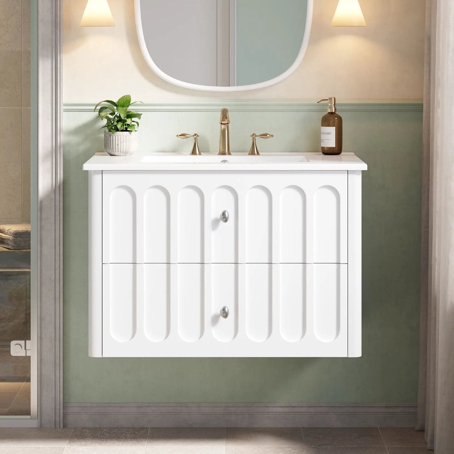 Floating white vanity with brass hardware, oval knobs, rounded edge and soft-close drawers on Tampa Home & Garden Store