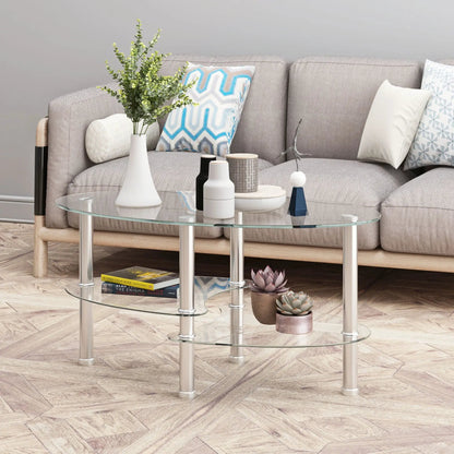Transparent oval glass coffee table with two shelves and chrome legs in living room on Tampa Home & Garden Store