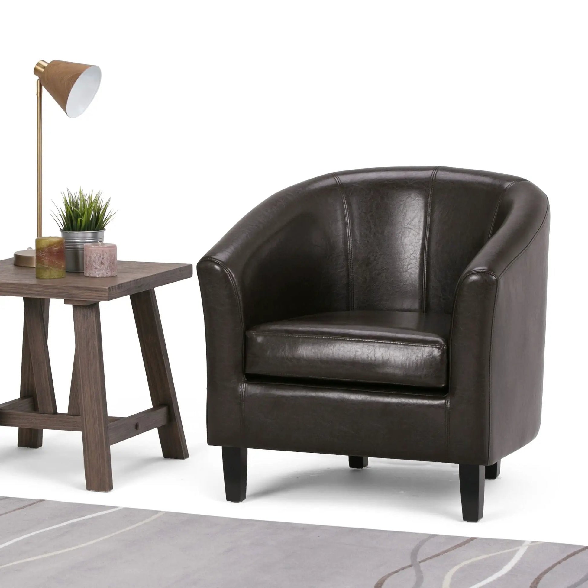Austin Transitional Tub Chair, dark brown leather, paired with a wooden side table and brass lamp on Tampa Home & Garden Store