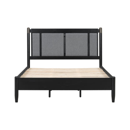 Queen bed frame with black metal posts, dark wood headboard rails, and grey upholstered panels on Tampa Home & Garden Store
