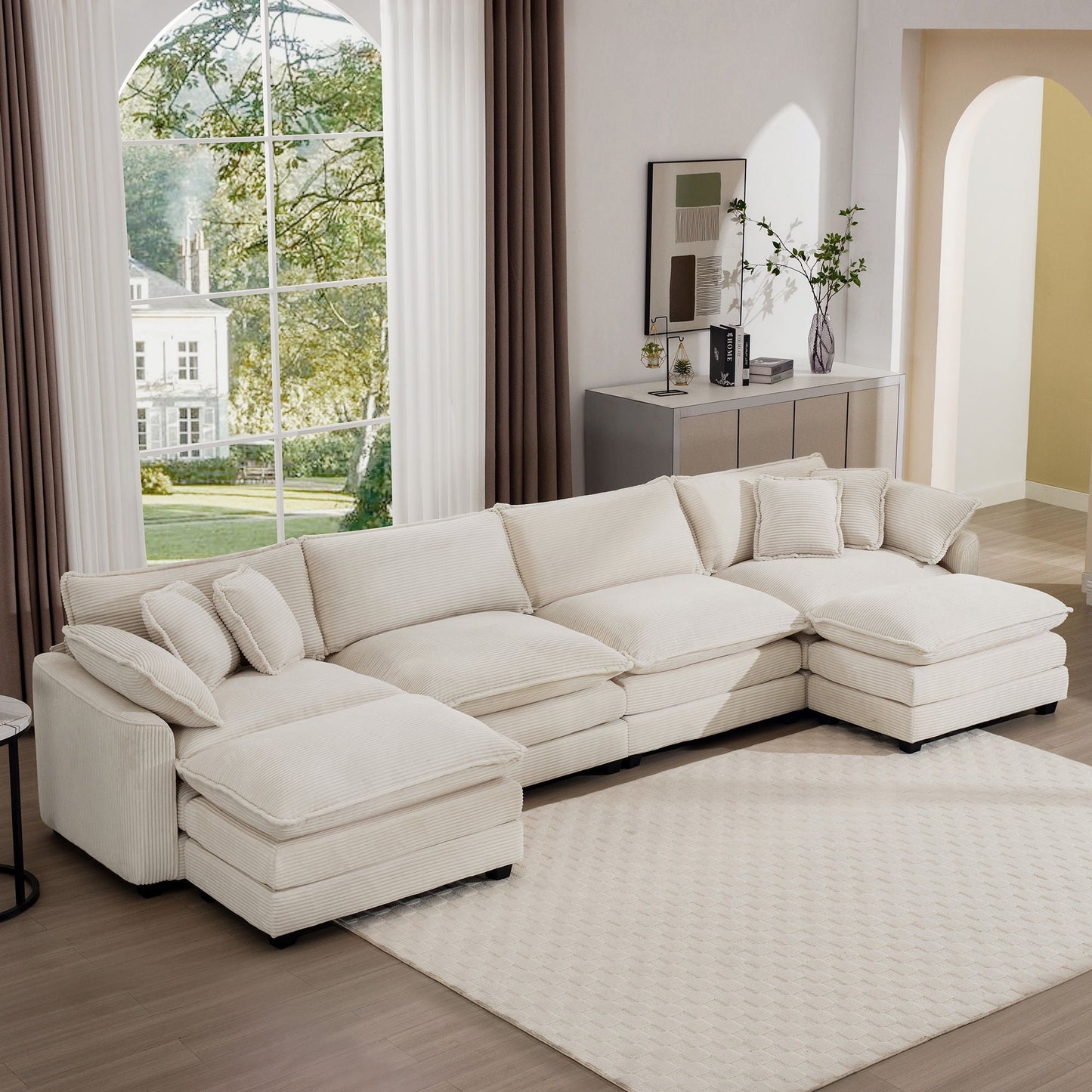 Modern oversized modular sofa with ottoman in cream ribbed fabric, low back, deep seating on Tampa Home & Garden Store