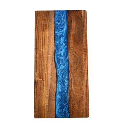 Acacia wood charcuterie board with blue epoxy ocean-wave resin inlay on Tampa Home & Garden Store