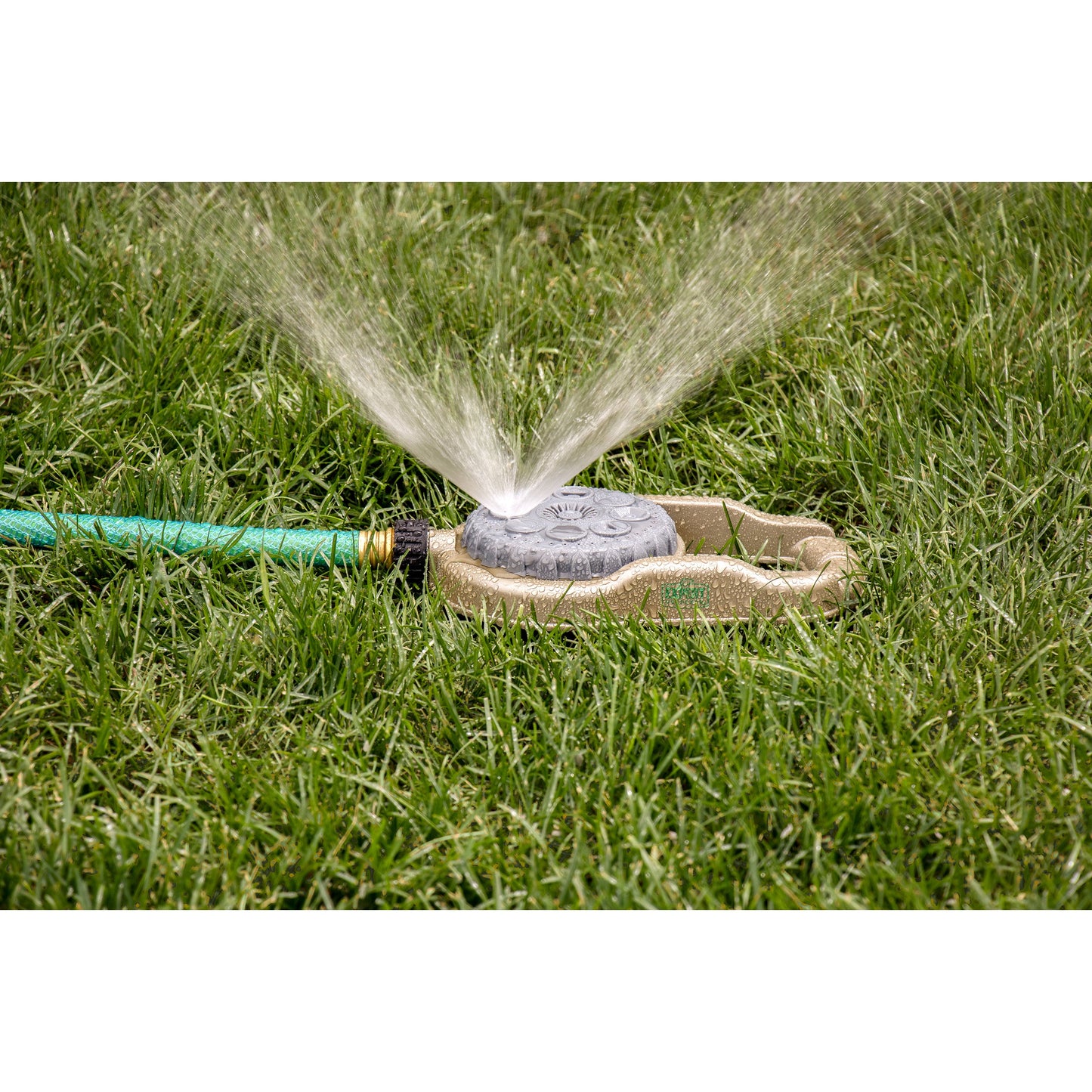 Orbit Irrigation metal 8-pattern lawn sprinkler on weighted base spraying lawn on Tampa Home & Garden Store