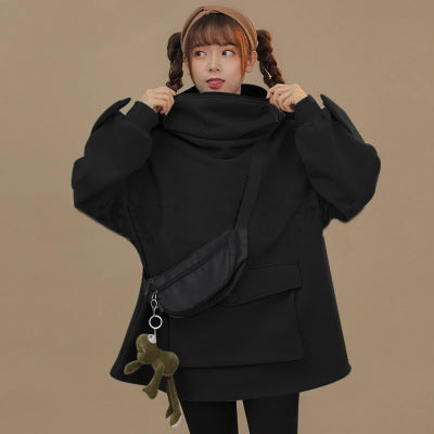Stevvex women's black oversized hoodie pullover with hood and front pockets on a model on Tampa Home & Garden Store