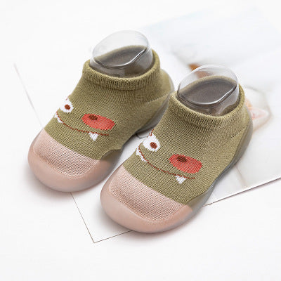 Infant non-slip indoor socks by Stevvex, olive green with pink toe caps and cartoon face on Tampa Home & Garden Store