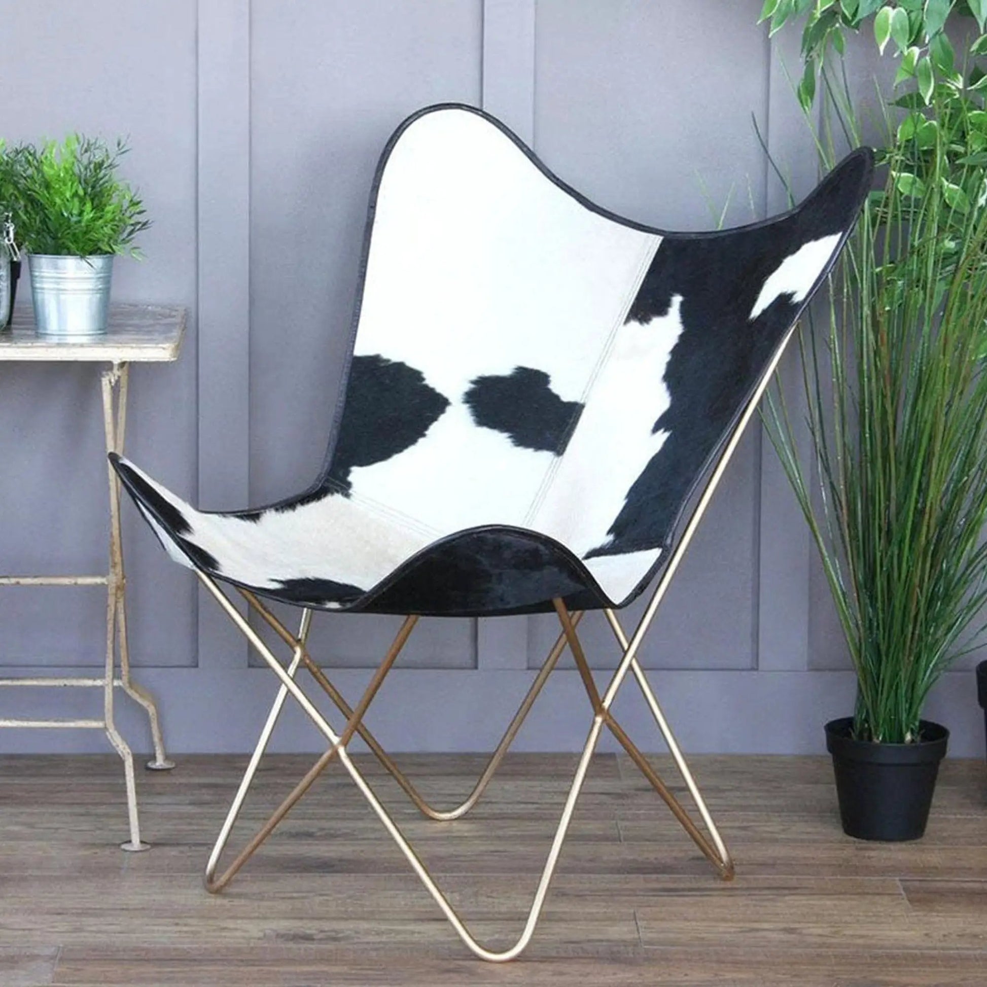 The Holsteins Butterfly Chair by Classy Leather Bags cowhide upholstery with gold-tone frame on Tampa Home & Garden Store