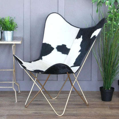 The Holsteins Butterfly Chair by Classy Leather Bags cowhide upholstery with gold-tone frame on Tampa Home & Garden Store