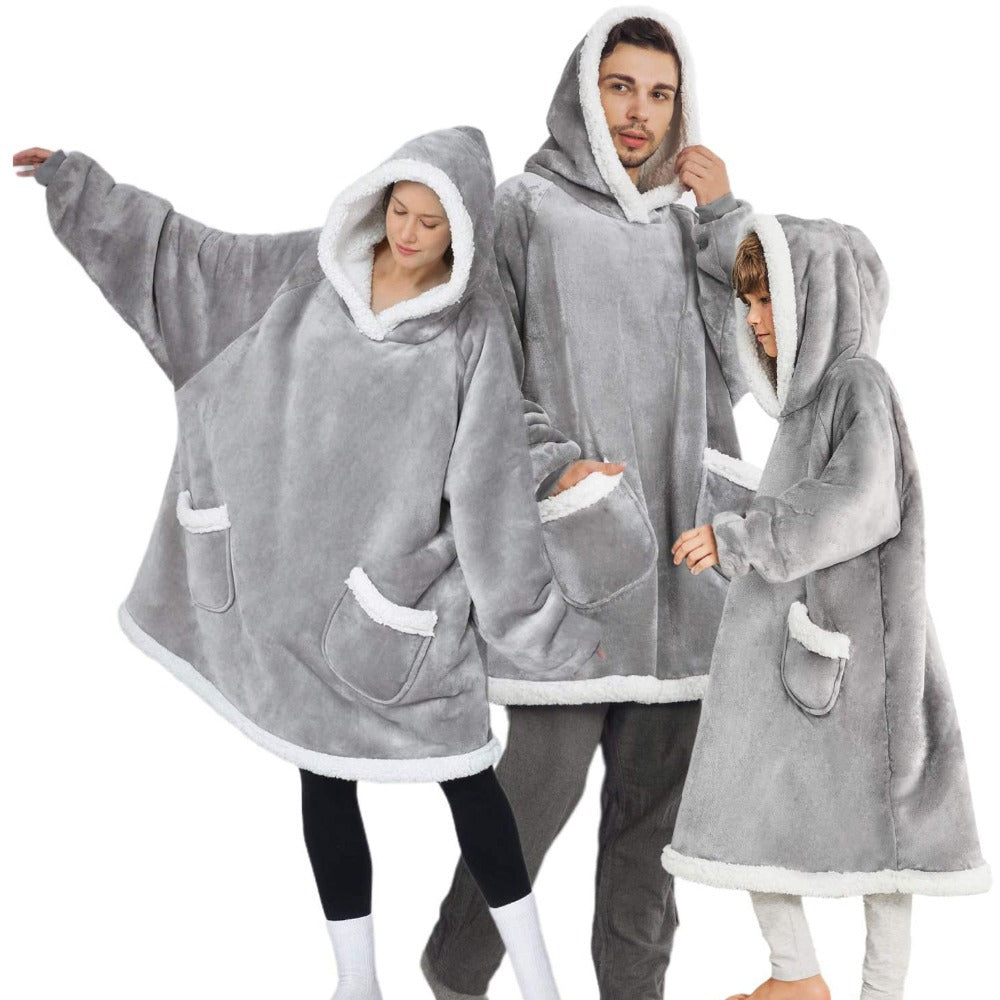Three Stevvex oversized hoodie blanket in gray fleece with sleeves, hood, white trim and pockets on Tampa Home & Garden Store