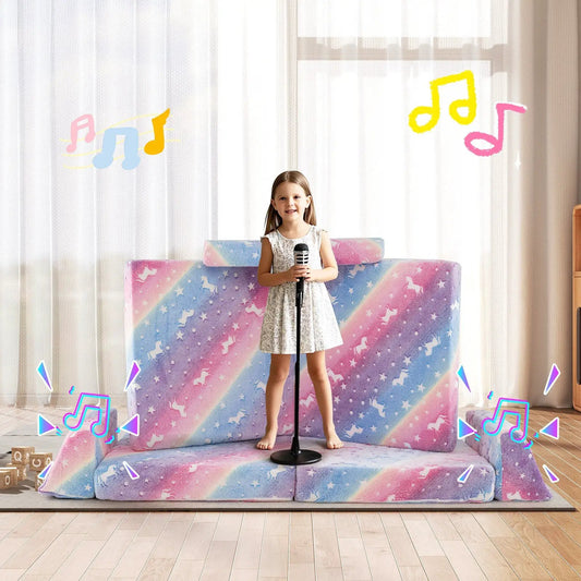 Modular kids glow-in-the-dark play couch in pastel rainbow unicorn print; girl with microphone on Tampa Home & Garden Store