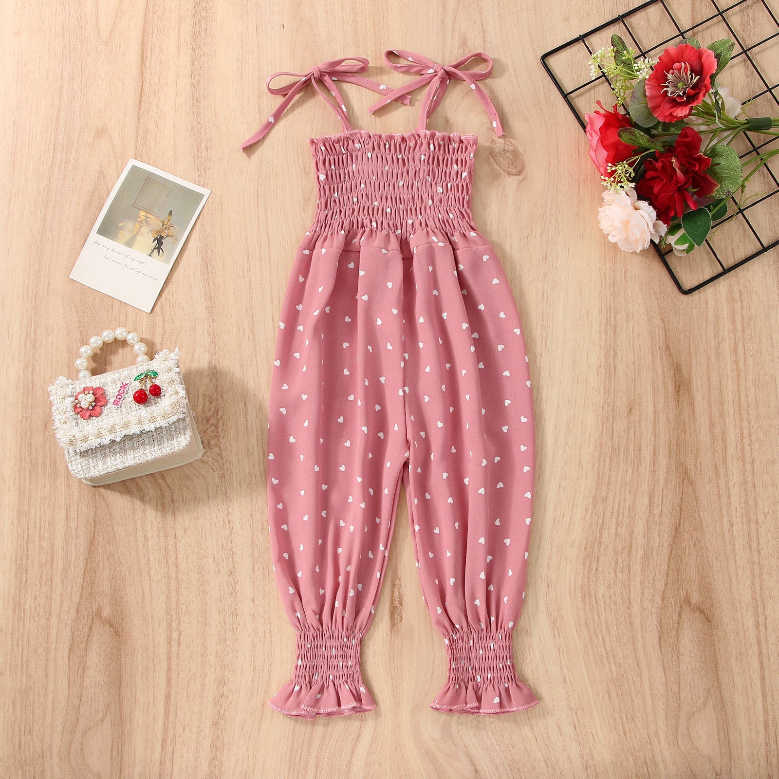 Stevvex pink sleeveless baby romper with heart print, smocked cotton bodice and tie straps on Tampa Home & Garden Store