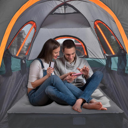 Umbrauto truck tent with awning for 5.5–5.8 ft beds, gray with orange trim, two people inside on Tampa Home & Garden Store