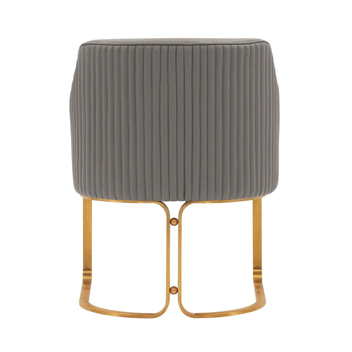 Arm chair with dark gray quilted upholstery featuring vertical channel stitching and brass legs on Tampa Home & Garden Store