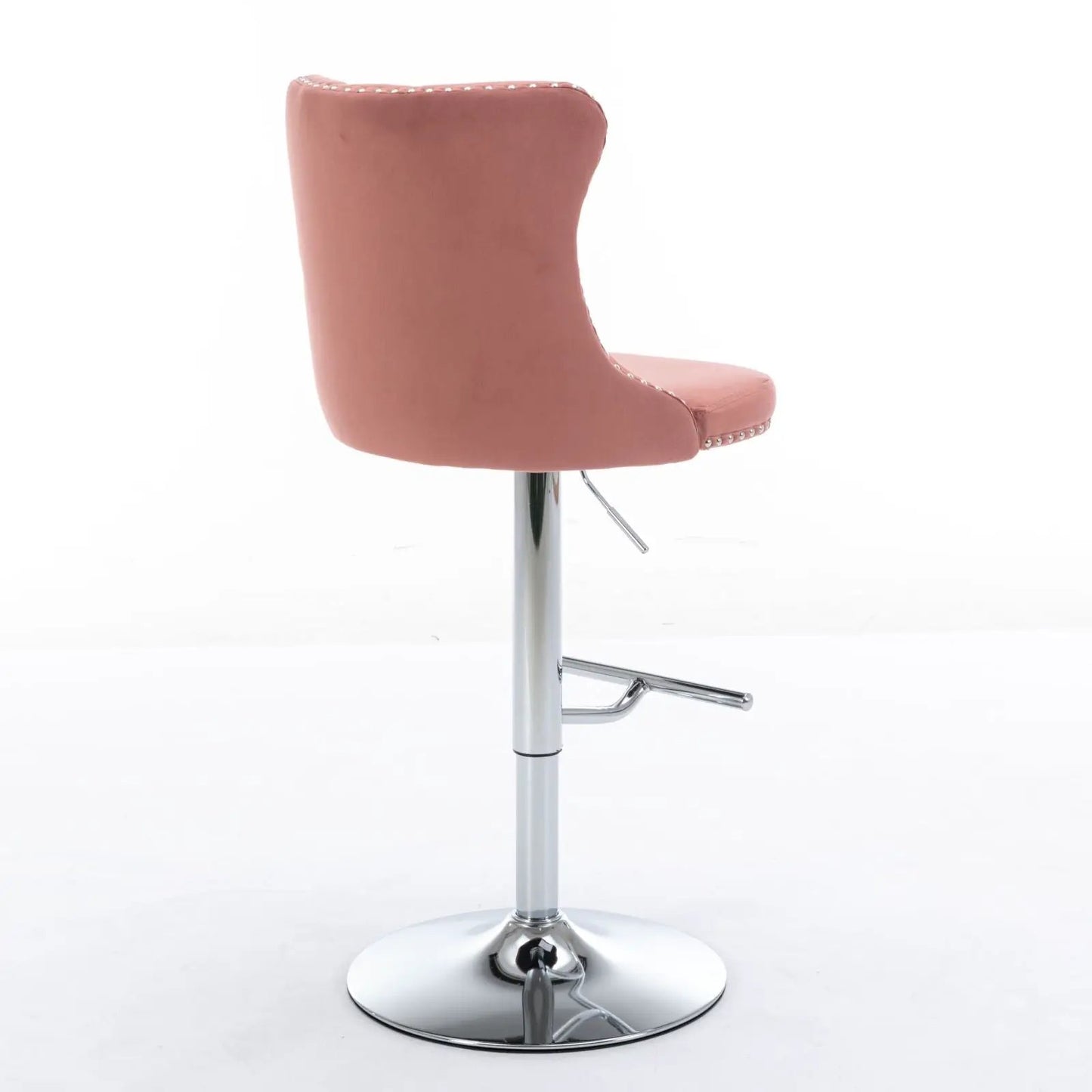 Pink tufted swivel barstool with chrome pedestal base and footrest on Tampa Home & Garden Store