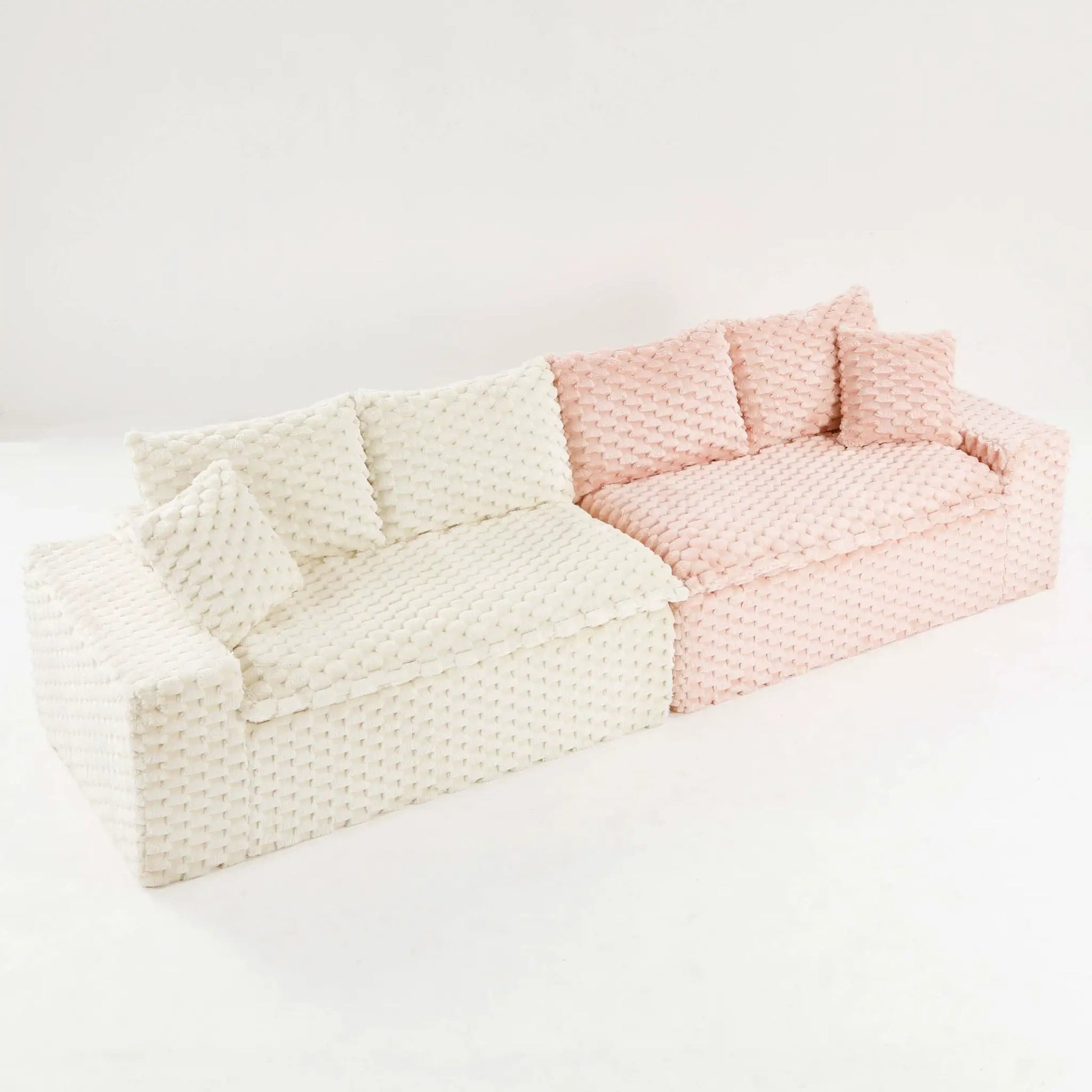 Stationary sofa with ivory and blush pink chunky knit throws Unique Piece Furniture on Tampa Home & Garden Store