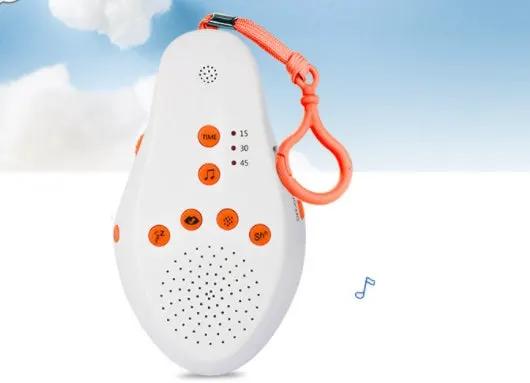 Baby pacifying sleep aid electronic music device, white oval with orange buttons and strap on Tampa Home & Garden Store
