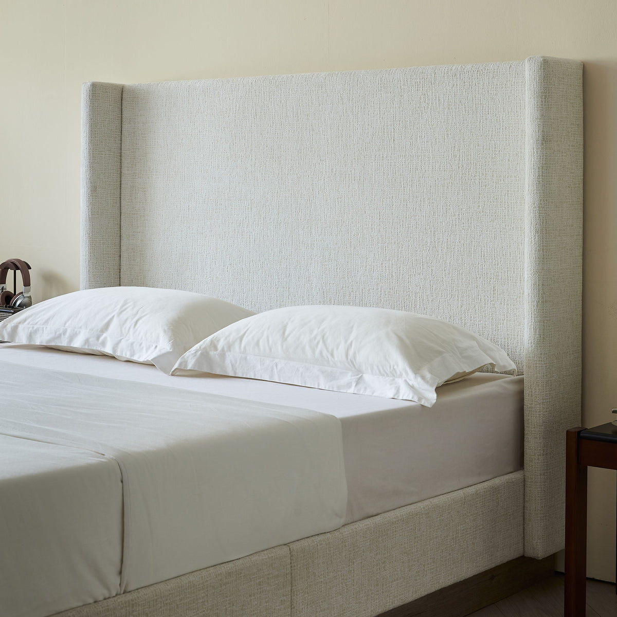 Hosford upholstered wingback bed in beige fabric with tall headboard on Tampa Home & Garden Store