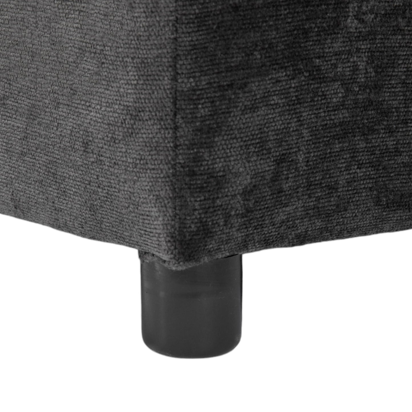 Sectional sofa leg close-up in charcoal gray fabric with a black metal leg base on Tampa Home & Garden Store