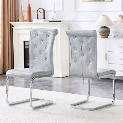Pair of elegant design upholstered dining chairs with crystal button tufting in silver gray on Tampa Home & Garden Store