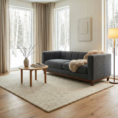 Soft Loveseat Sofa by HouseOfZazla in dark gray upholstery with wooden legs in living room on Tampa Home & Garden Store