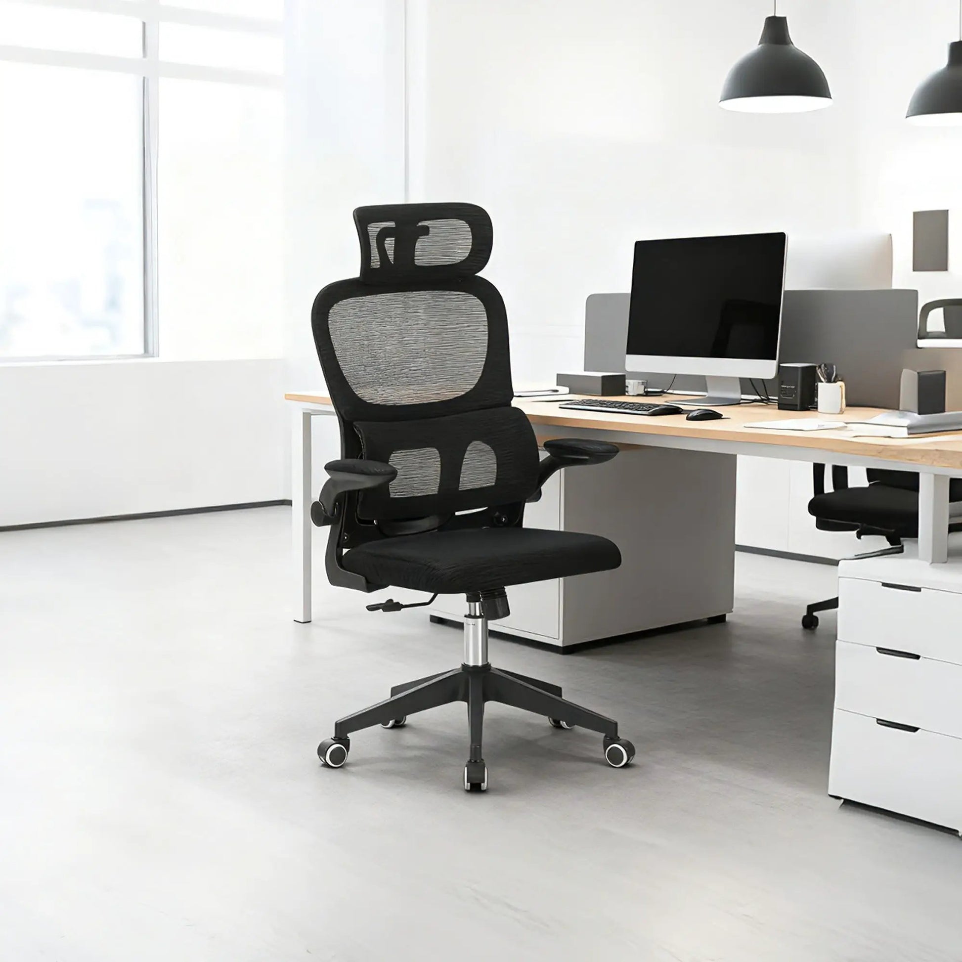 High-back ergonomic swivel office chair in black mesh with lumbar support and tilt, 3D headrest on Tampa Home & Garden Store