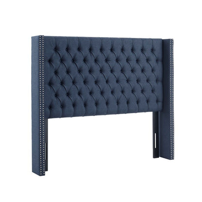 Transitional upholstered headboard by HouseOfZazla in blue tufted buttons and nailhead trim on Tampa Home & Garden Store