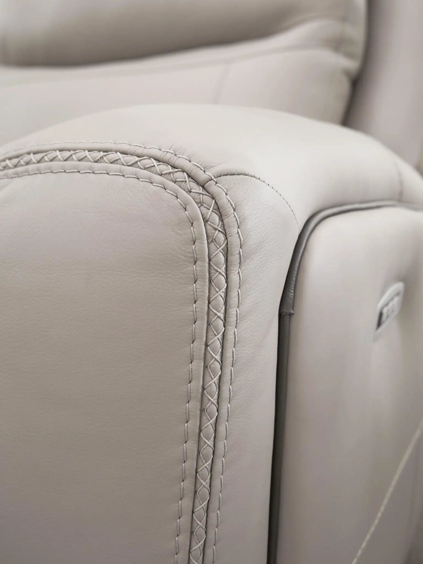 Gravier Reclining Sectional beige leather with braided arm stitching on Tampa Home & Garden Store