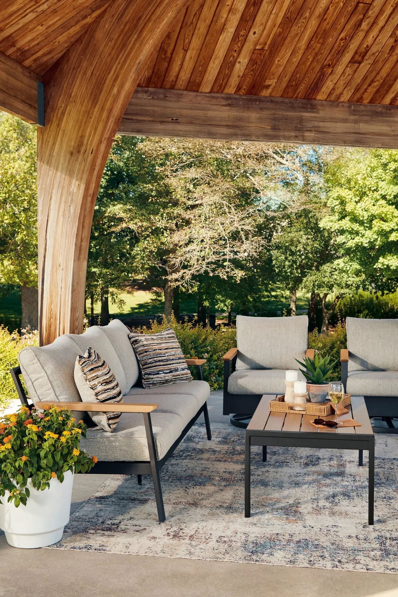 Carmel Highlands 4-piece outdoor set sofa, chairs, table in dark brown with beige cushions on Tampa Home & Garden Store