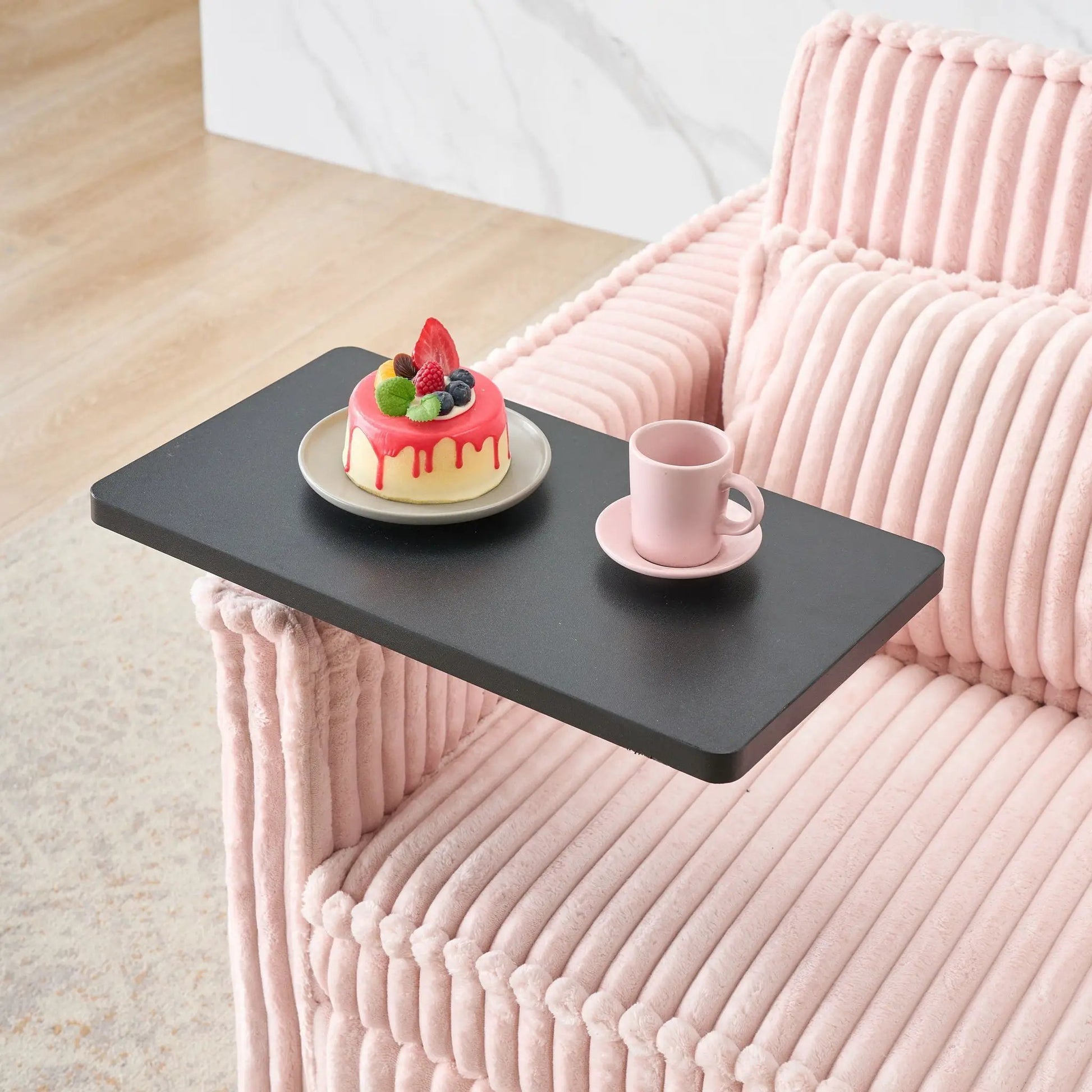 Pull-out sleeper sofa with movable tabletop and USB ports in blush pink ribbed upholstery on Tampa Home & Garden Store
