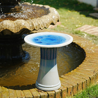 Handmade glazed ceramic bird bath with blue swirl saucer on a striped pedestal on Tampa Home & Garden Store