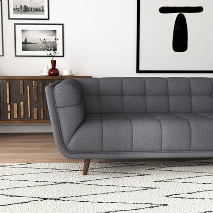 L-shaped tufted sofa in dark gray fabric with mid-century design by HouseOfZazla on Tampa Home & Garden Store