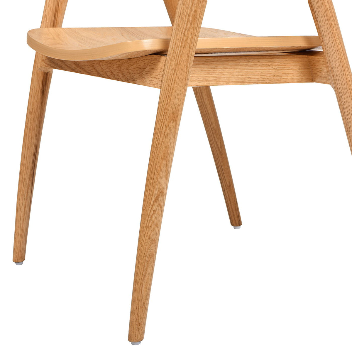 Scandinavian sculpted dining chair leg detail in warm natural brown oak on Tampa Home & Garden Store