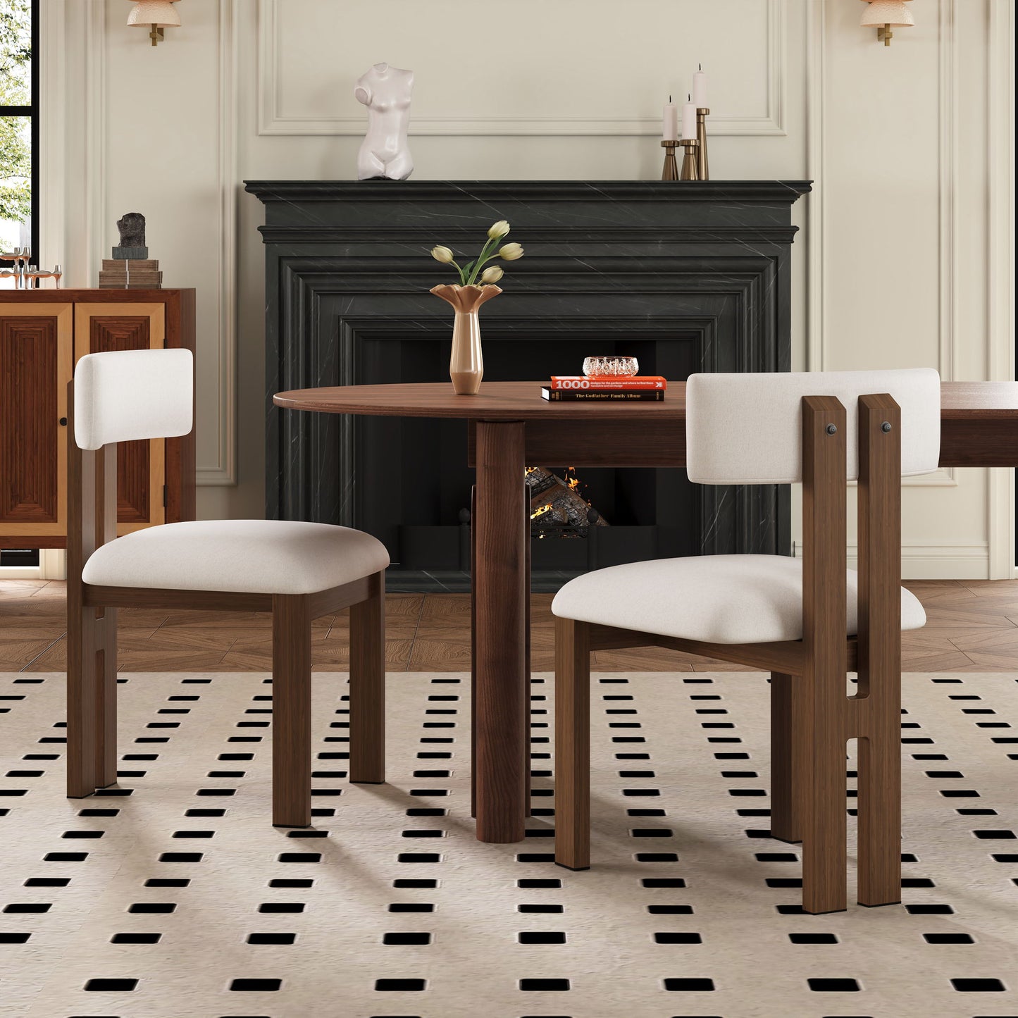 Modern upholstered armless dining chairs with dark wood legs around round table in chic dining room on Tampa Home & Garden Store