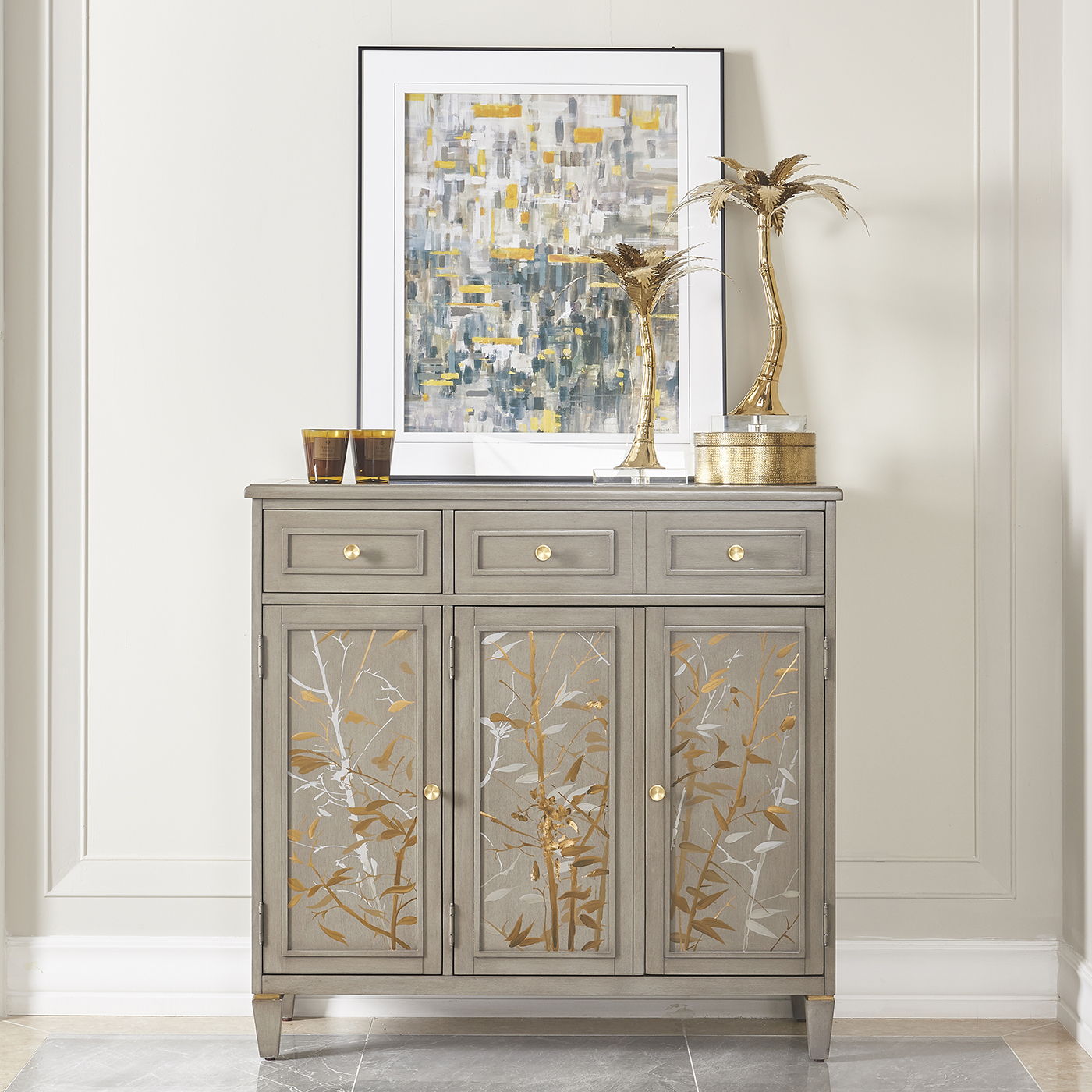 Dauphin gray cashmere entryway cabinet with three top drawers and gold botanical panel doors on Tampa Home & Garden Store