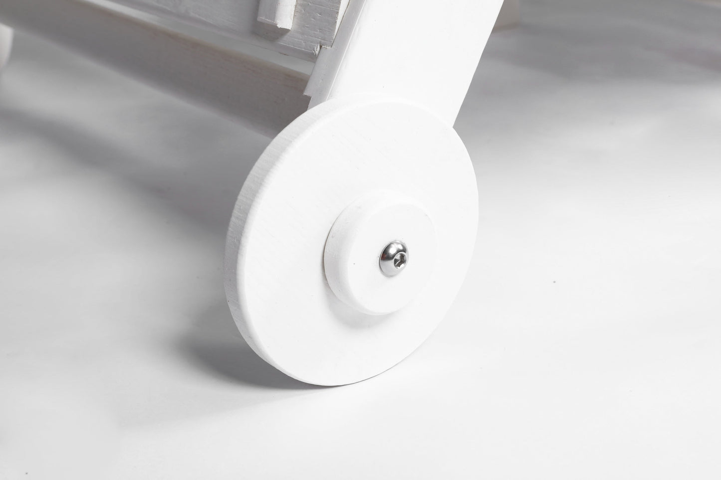 Outdoor lounge chair wheel close-up in white wood texture HDPE construction with metal axle on Tampa Home & Garden Store