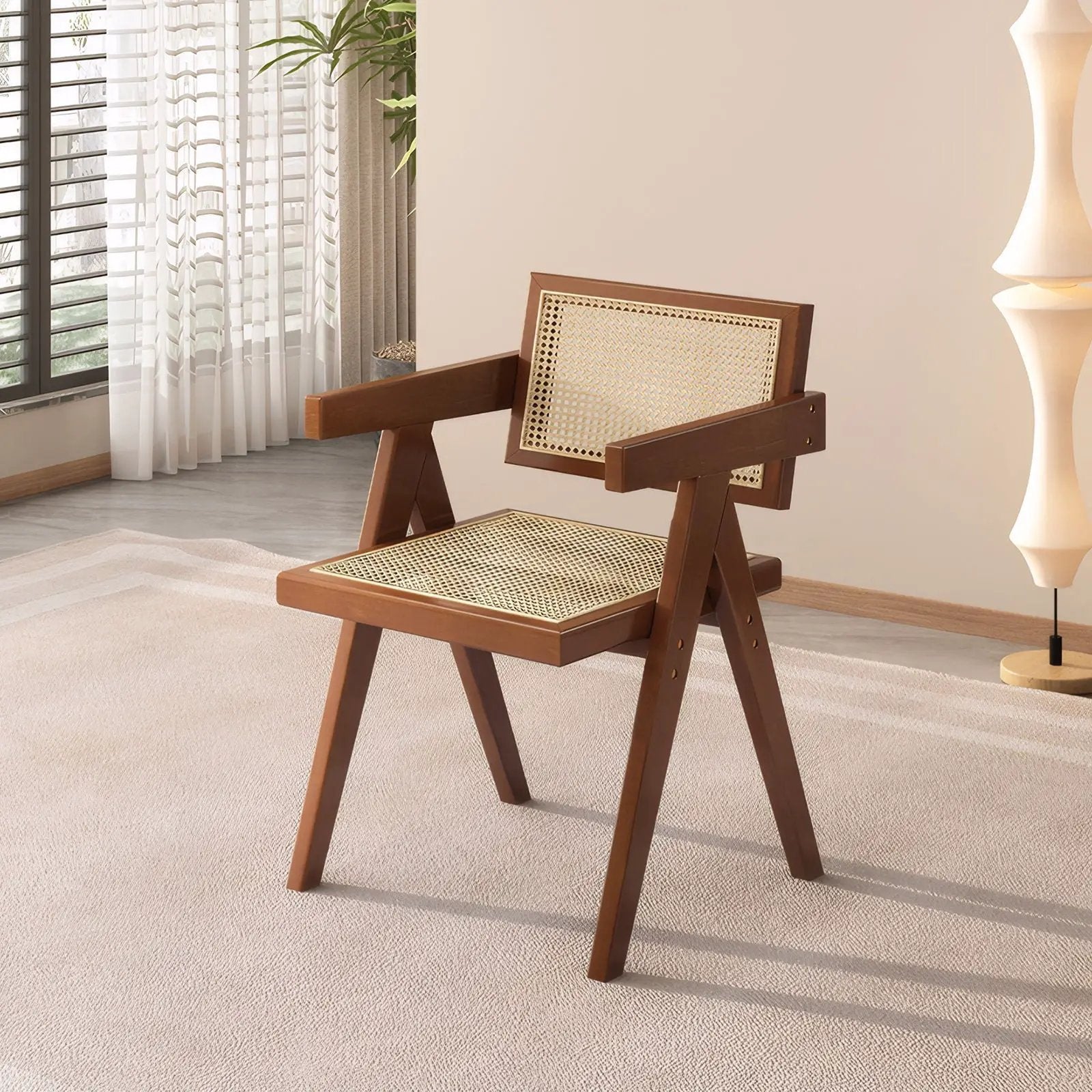 Modern mid-century dining chair with walnut wood frame and woven cane back and seat on Tampa Home & Garden Store