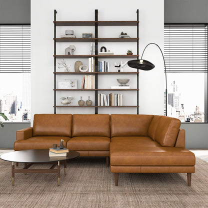 Corbin L-Shaped Sectional Sofa tan leather in a modern living room with bookshelf backdrop on Tampa Home & Garden Store