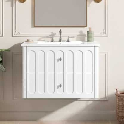 Floating white bathroom vanity with rounded-edge drawers, oval knobs, and silver faucet on Tampa Home & Garden Store
