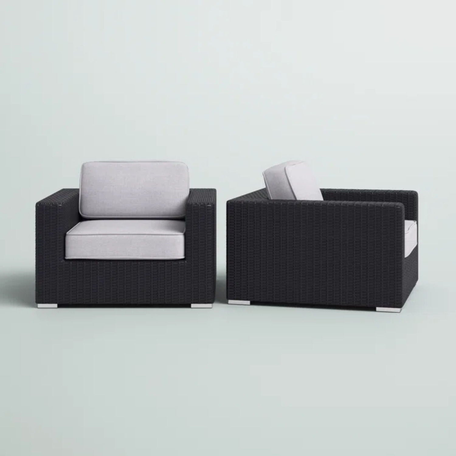 Pair of patio arm chairs with light gray cushions in black wicker frames HouseOfZazla on Tampa Home & Garden Store