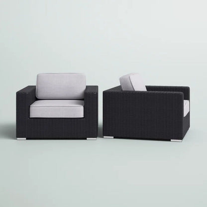 Pair of patio arm chairs with light gray cushions in black wicker frames HouseOfZazla on Tampa Home & Garden Store
