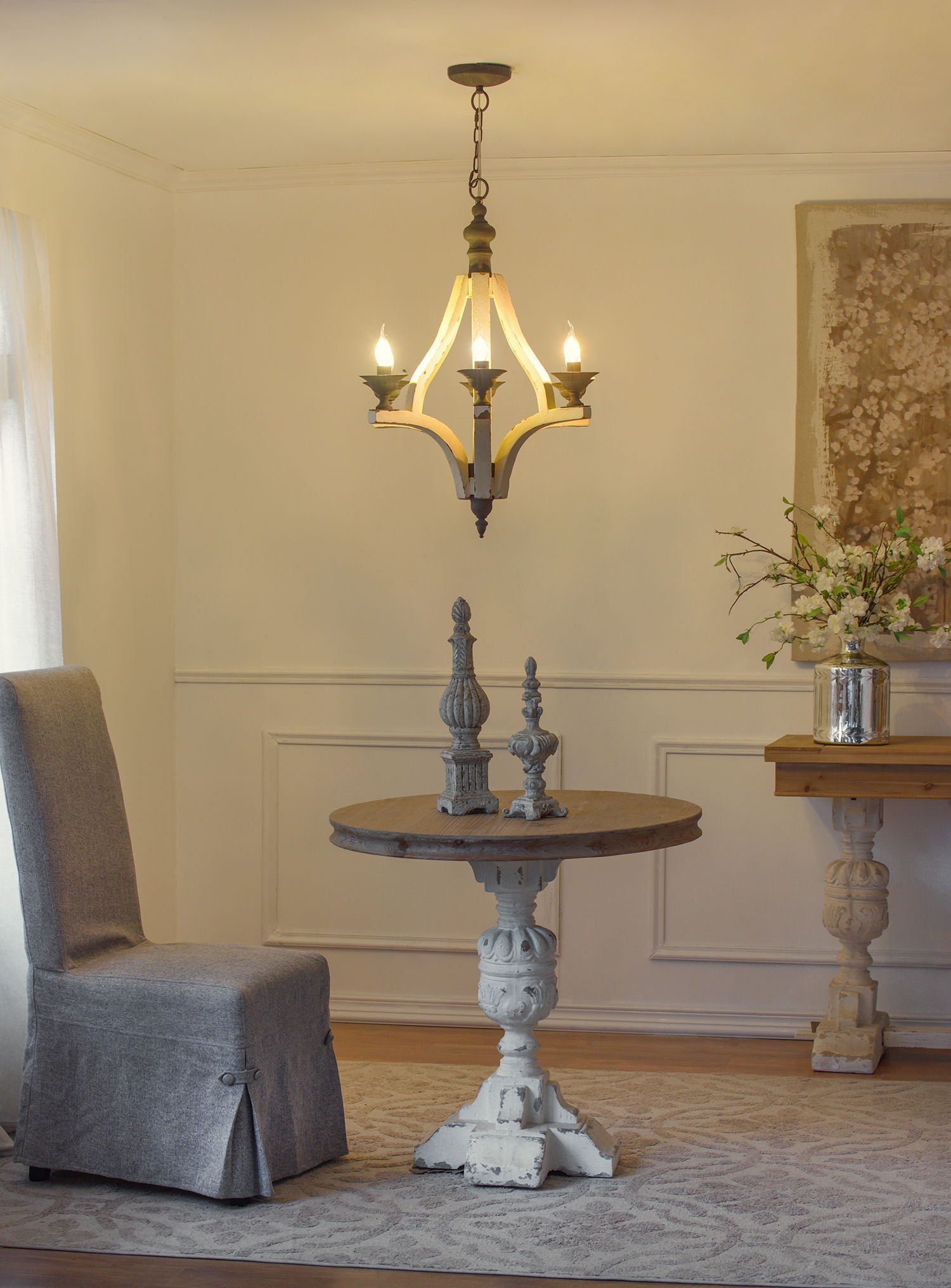 6-light wood chandelier with distressed cream finish and adjustable chain in dining room on Tampa Home & Garden Store