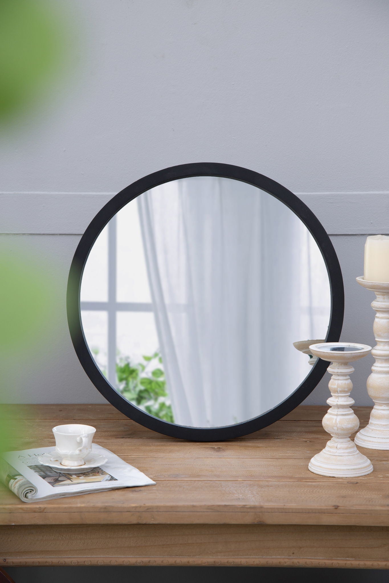 Circle wall mirror with black wooden frame by HouseOfZazla for living room decor on Tampa Home & Garden Store
