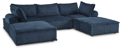 Bales sectional by Unique Piece Furniture in navy blue corduroy with chaise on Tampa Home & Garden Store