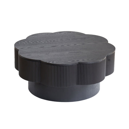 Coffee table plum blossom shaped in dark brown with ribbed sides on Tampa Home & Garden Store
